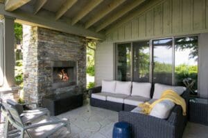 All year round, the back patio is an oasis with plenty of seating and a fireplace.