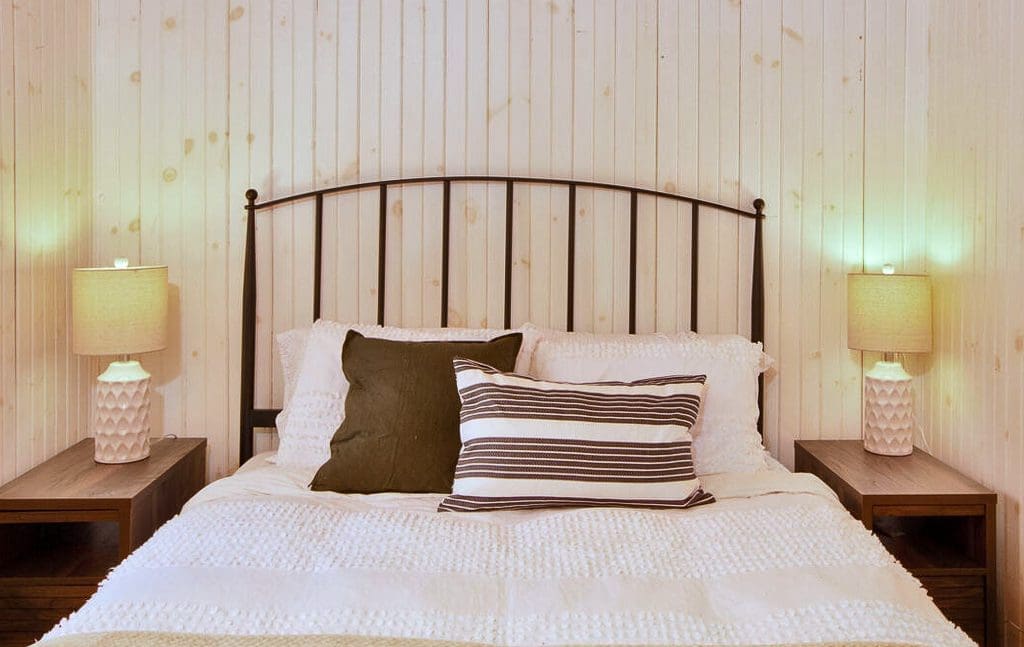 The master bedroom features the same beautiful furnishings seen throughout the house.