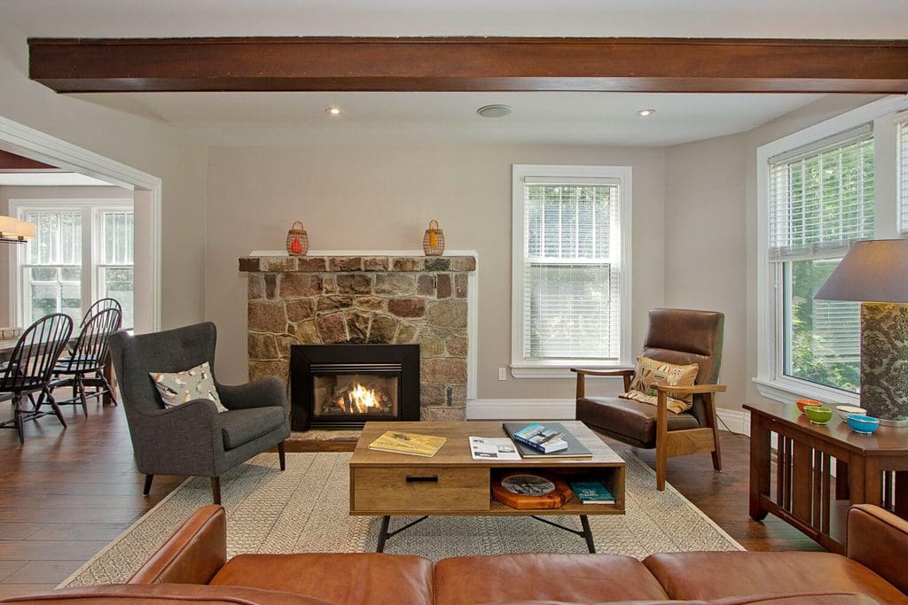 Front door opens into the sitting room where you can enjoy a good book in front of the fireplace