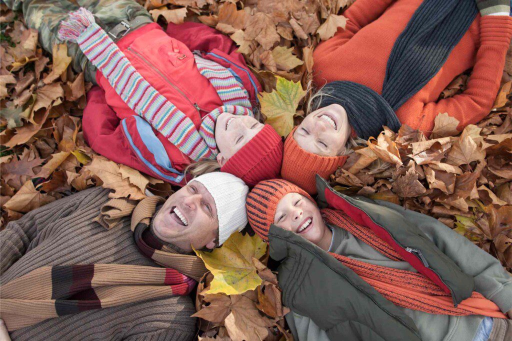 family lying together in autumn leaves laughing 2026 01 09 09 15 42 utc
