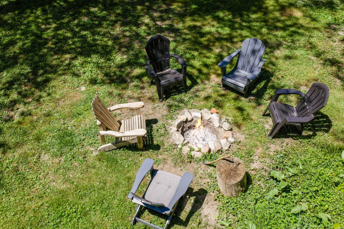 Wood fire pit, Adirondack chairs, beautiful gardens. The first fire of the trip always starts here.