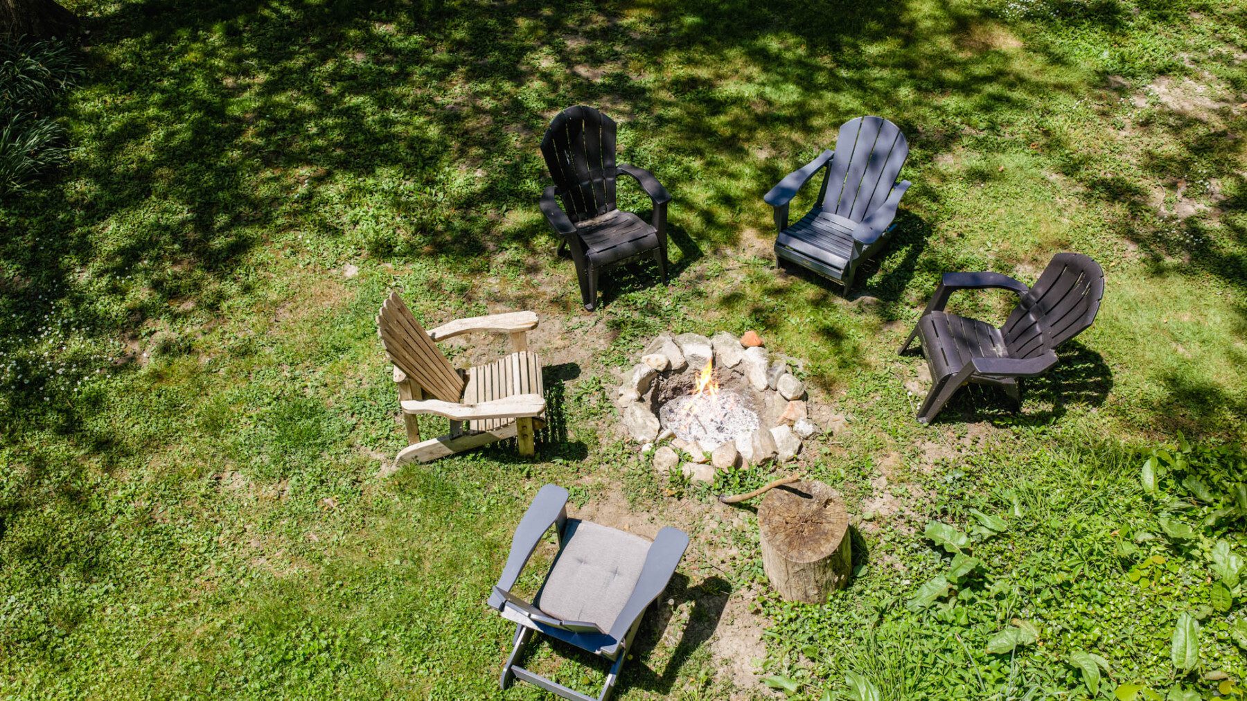 Wood fire pit, Adirondack chairs, beautiful gardens. The first fire of the trip always starts here.